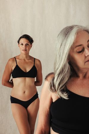Body positive women of different ages embracing their natural bodies