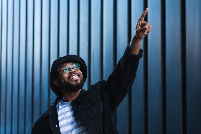 Excited Black man pointing up