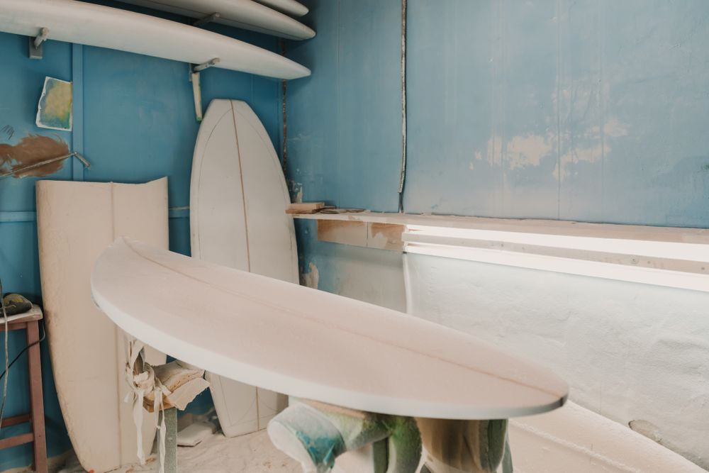 Workshop with surf boards near different tools