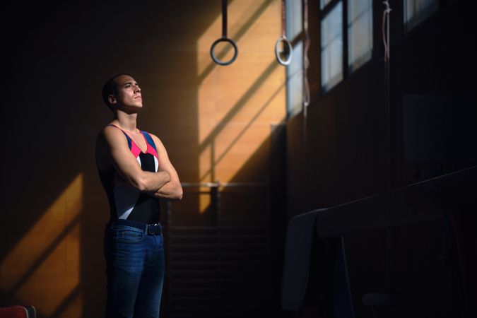 Young male gymnast concentrating before performing his exercises
