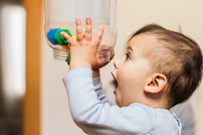 funny baby throwing toys