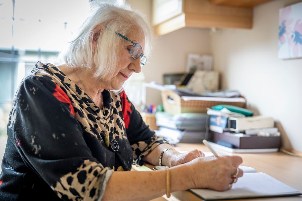 Woman writing at home