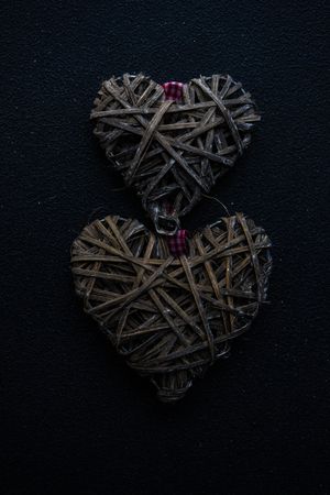 St. Valentines card concept with two weaved hearts