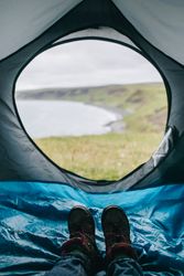 Feet looking out tent window