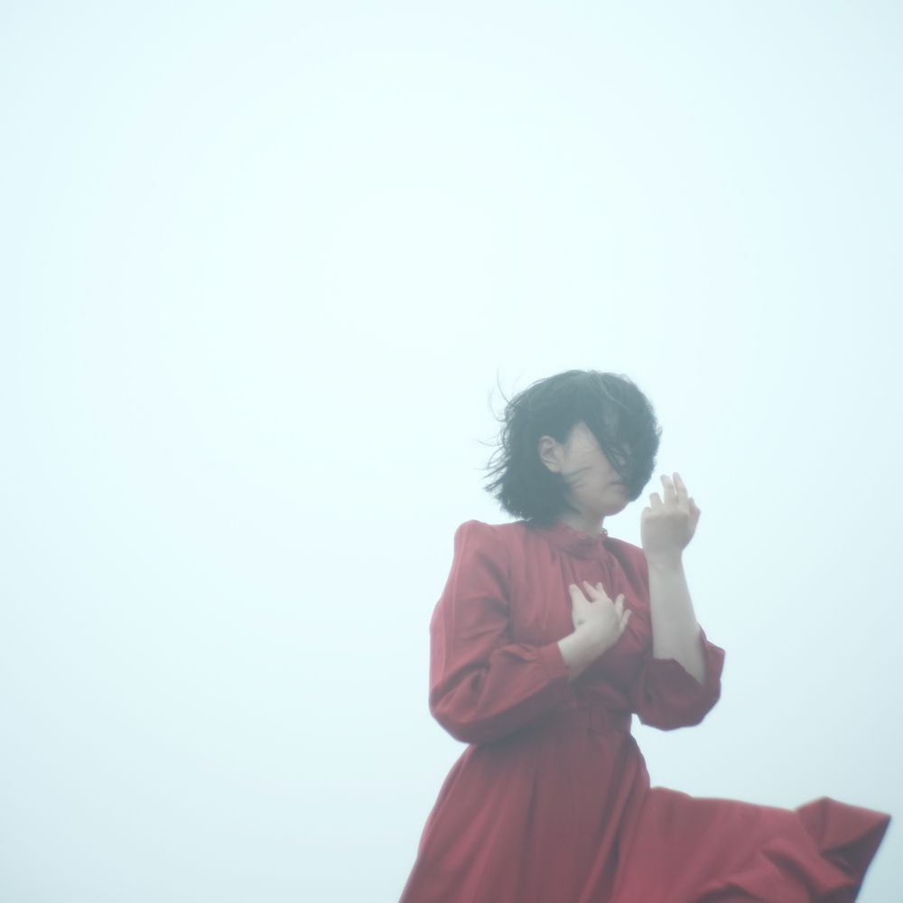 Woman in red long sleeve dress outdoor