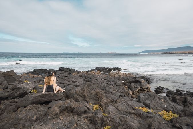 Sensual female near stormy sea