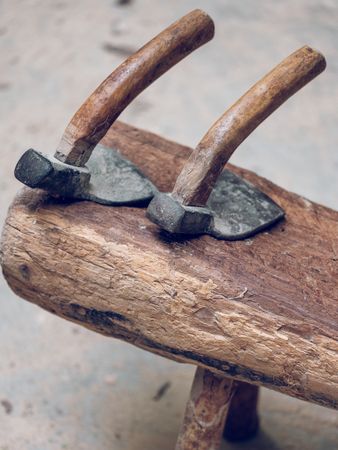 Adze tools on wooden surface