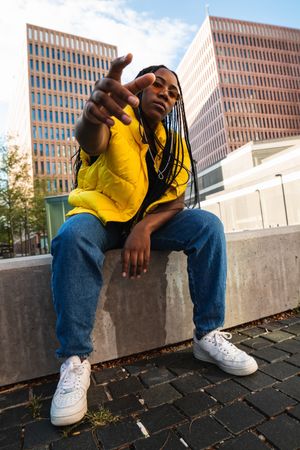 Stylish Black woman pointing at camera