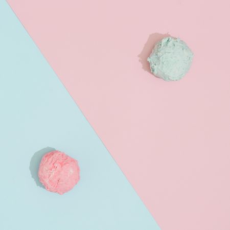 Ice cream scoops on pastel pink and blue background