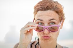 Woman in sunglasses resting on resort