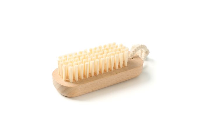 Wooden bath brush isolated on blank background