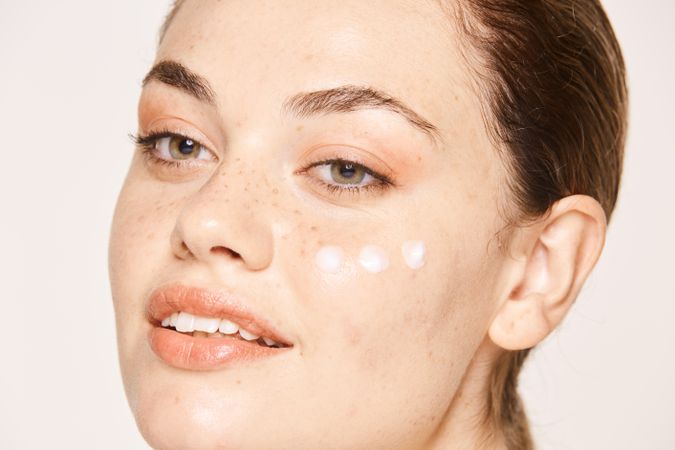 woman with cream on face