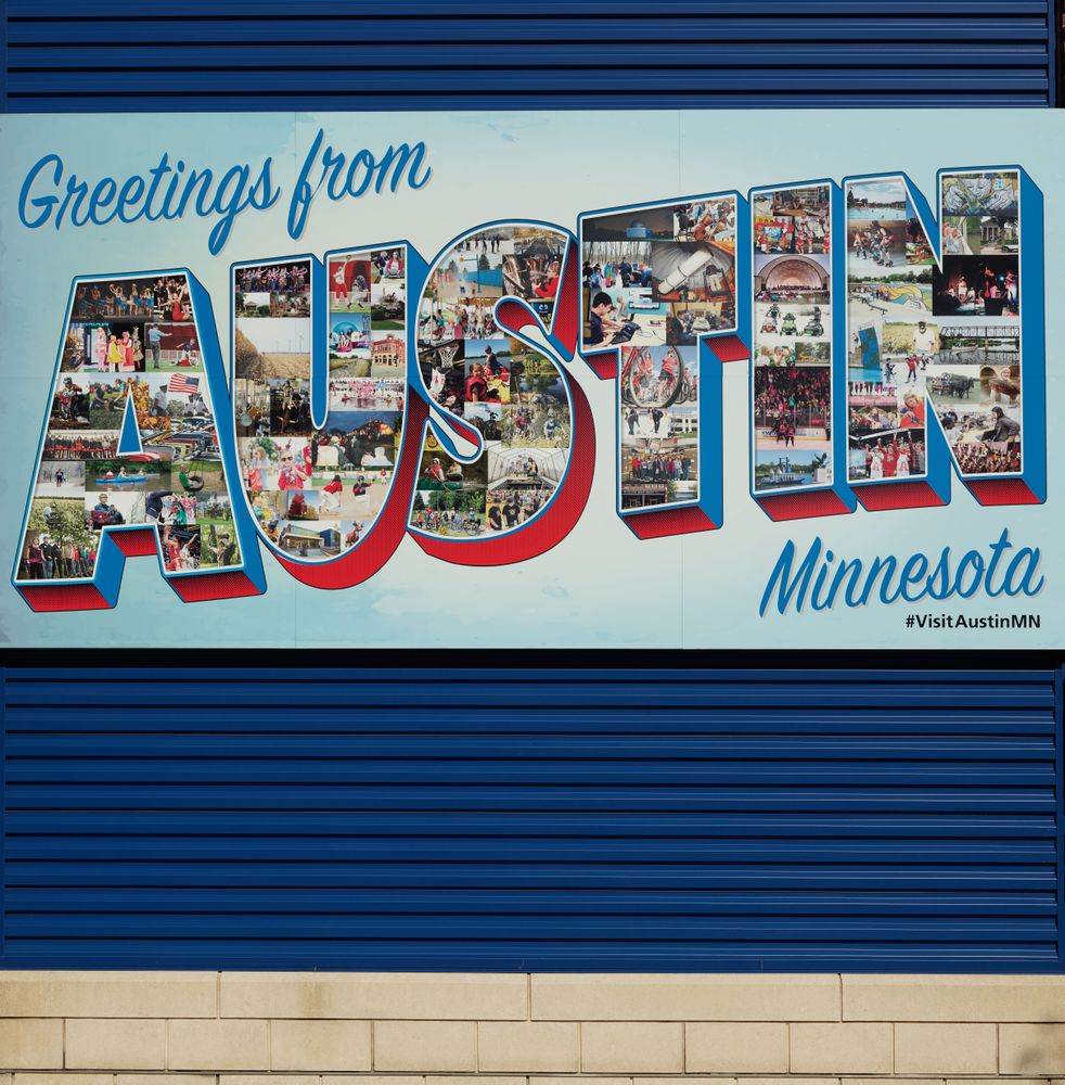 A Welome mural in the style of an old-style postcard in Austin, Minnesota