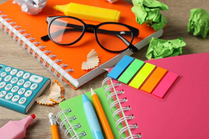 Close up of colorful stationary on wooden desk