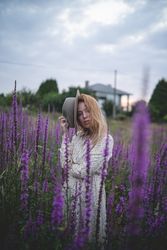 Romantic women in salvia field