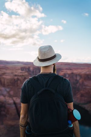 Bearded traveler looking at canyon