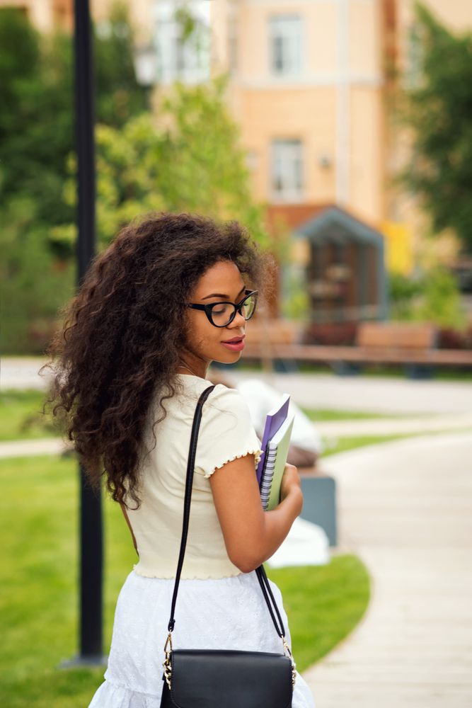Back of young Black female student