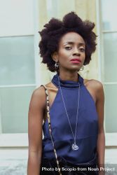 Portrait of woman with afro hair wearing blue top 5aMKv5