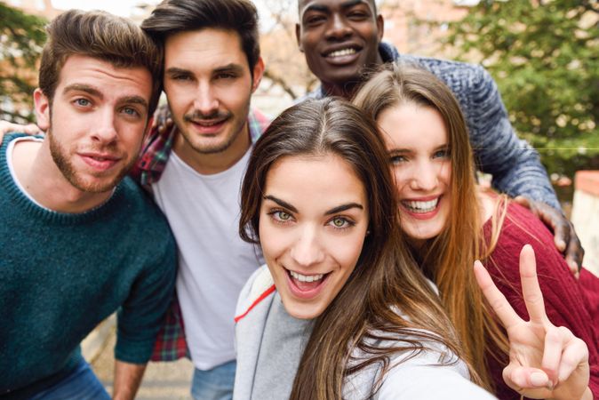 Group of friends looking at camera and smiling for picture