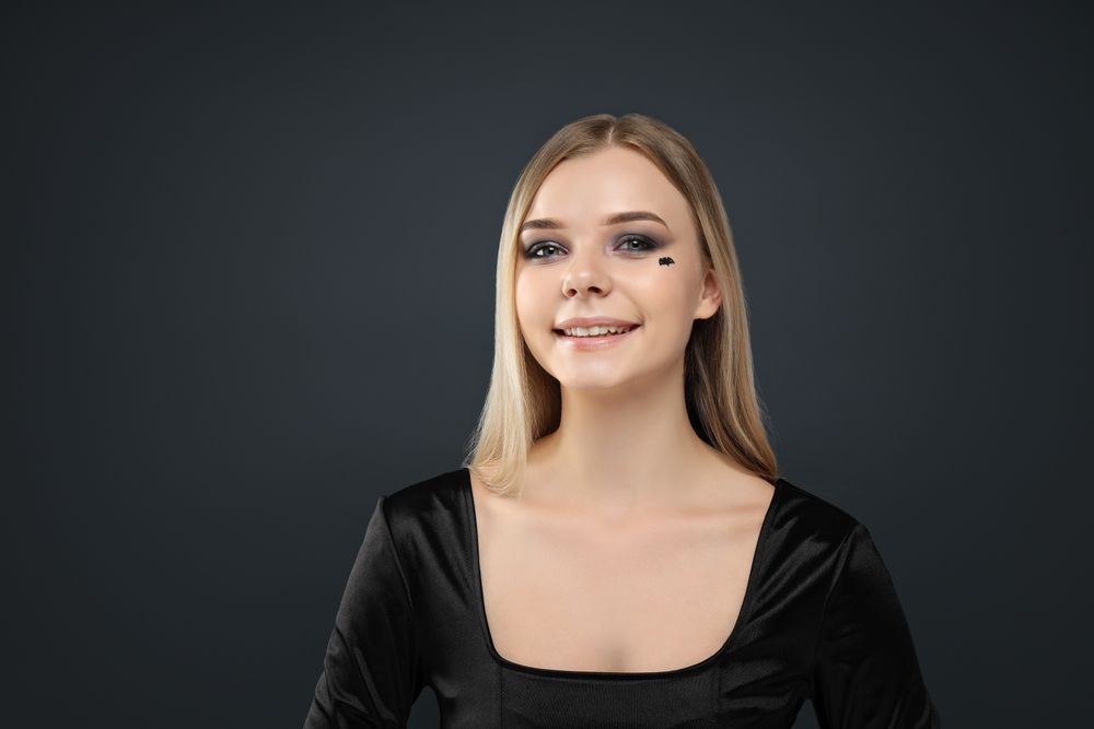 A woman with dark makeup for a Halloween party