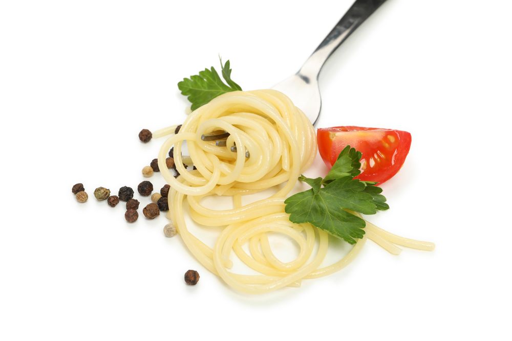 Fork with tasty pasta isolated on blank background