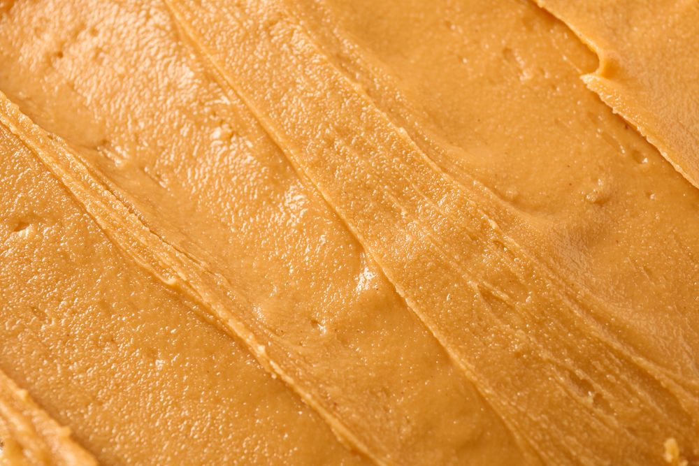 Peanut butter as background, space for text and closeup