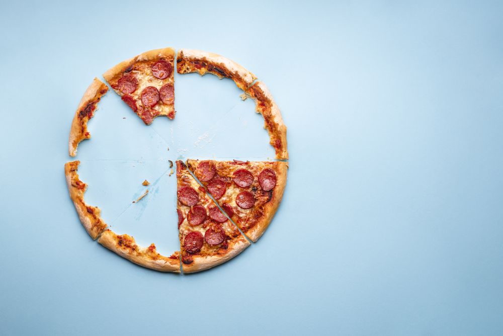 Above view of an eaten delicious homemade pepperoni pizza