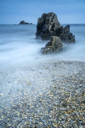 Playa de Gueirua stone beach on foggy day