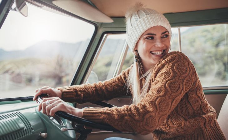 Smiling woman enjoying her road trip