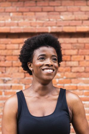 Happy Black woman with Afro hairstyle looking away