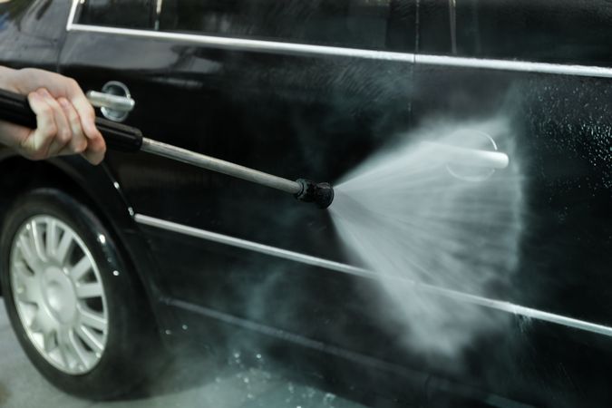 A man washes a car. Clear car concept