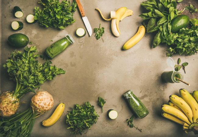 Smoothie ingredients with avocado, banana, zucchini, on grey table, with copy space