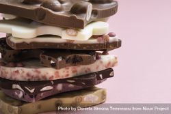 Swiss chocolate assortment in a stack on pink background 5QQLg5