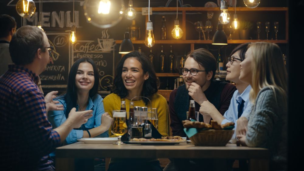 Diverse Group of Young People in Stylish Hipster Restaurant.