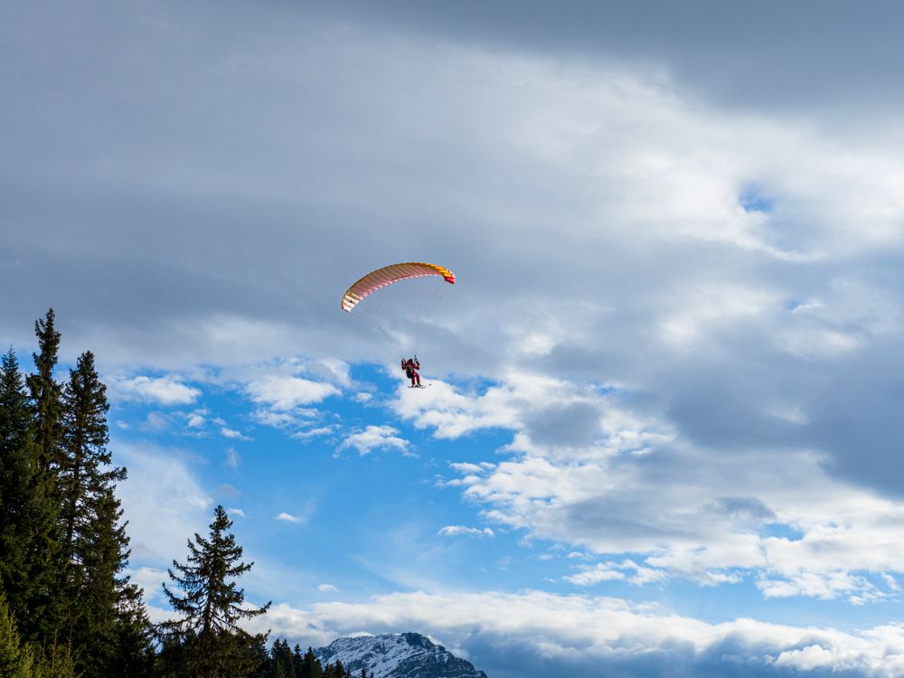 Paragliding skier, extreme sport, flying and gliding.