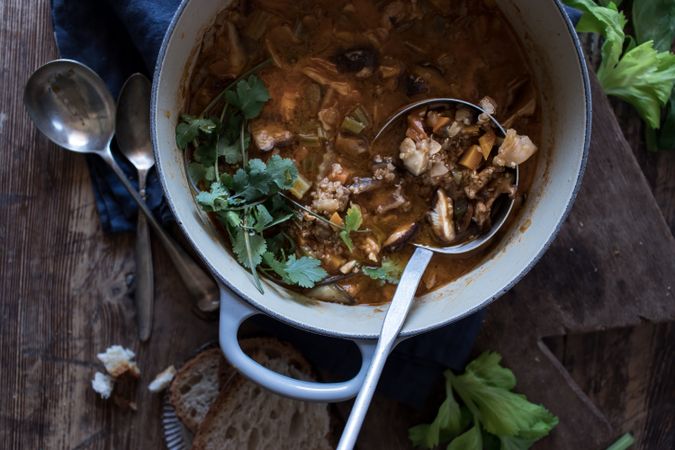 Bread and parsley near quinoa soup