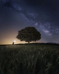Starry sky and person with ray of light