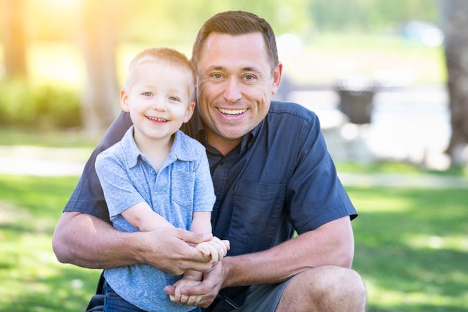 Young Father and Son Having Fun At The Park