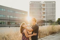 Romantic couple in sunlight in city street