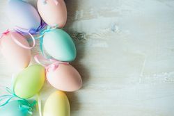 Easter card concept with pastel eggs with space for text