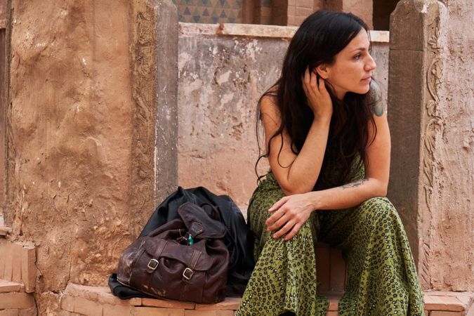 Woman on street between ancient buildings