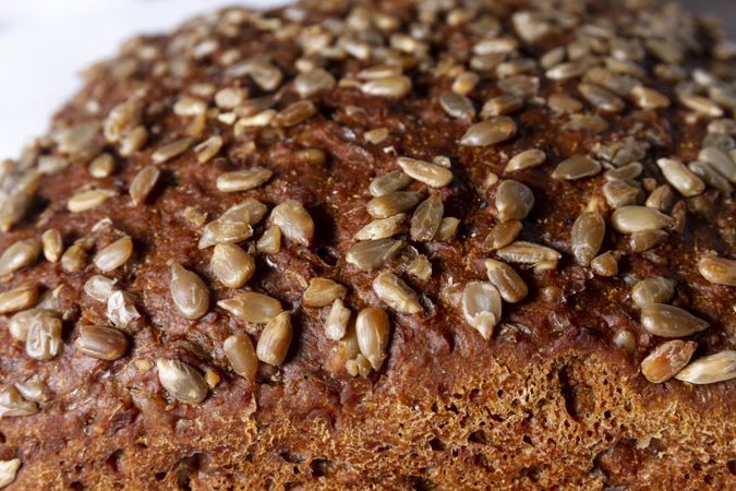 Loaf of bread with grains and poppy seeds