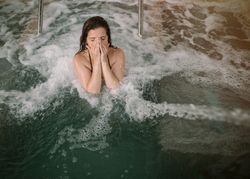 Woman relaxing in bath with hydro massage
