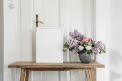 Vintage spring floral still life with blank picture frame mockup on old wooden bench