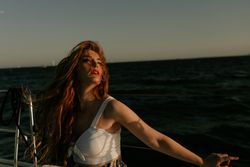 Pleased woman traveling at sea