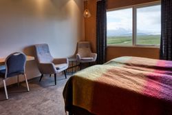 Comfortable hotel room with rural view from window