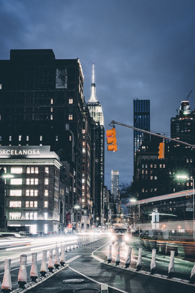 City buildings with lights turned on during night time