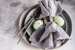 Easter table setting with green decorative eggs