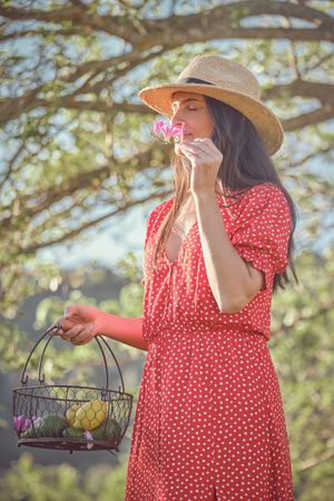 Woman with flower on summer walk