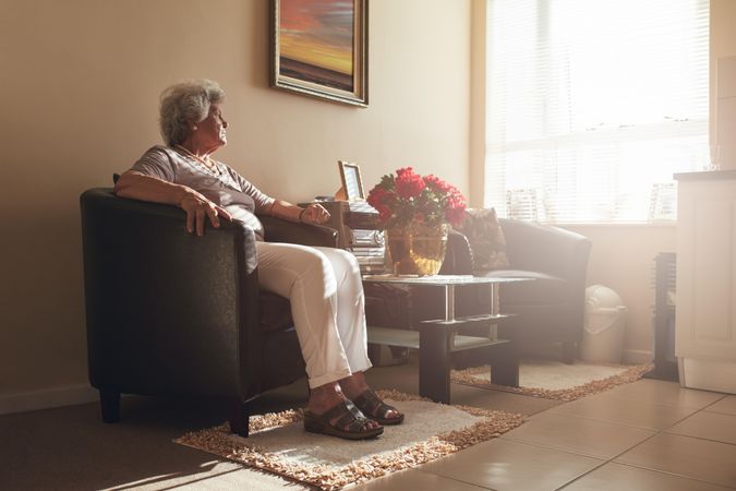 Older woman relaxing in living room
